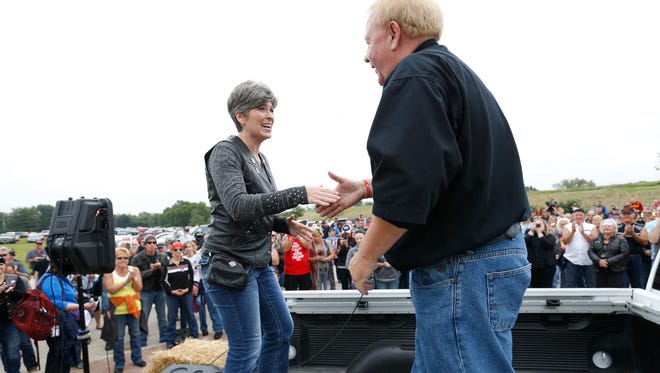 Sen. Joni Ernst is introduced to the crowd Saturday, Aug. 27, 2016, outside of the Big Barn Harley Davidson dealership before the start of the ride to the Iowa State Fairgrounds for the second annual Roast and Ride in Des Moines.