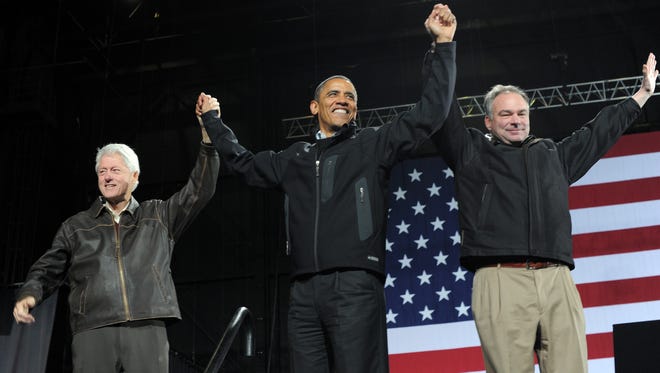 President Obama, former president Bill Clinton and  Kaine wave at supporters during a campaign rally at Jiffy Lube Live in Bristow, Va., on Nov. 3, 2012.