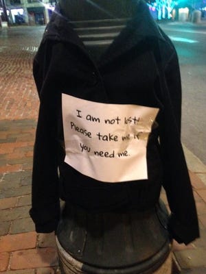 A Good Samaritan taped jackets with notes to light poles in downtown Portland, Maine, for people in need.