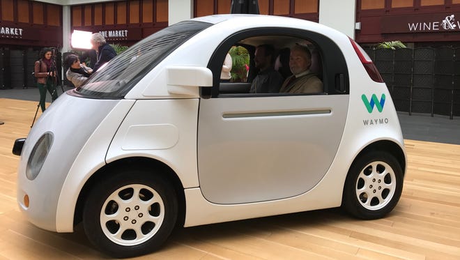 Waymo, the newly renamed Google self-driving car company, showed off its two seat prototype and new logo in the lobby of a San Francisco building Tuesday.
