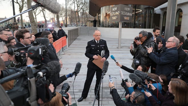 Assistant Commissioner, Mark Rowley of the Metropolitan Police makes a statement outside of New Scotland Yard in London.