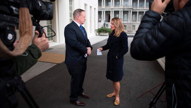 Spicer speaks with CNN's Sara Murray outside the White House on March 6, 2017.
