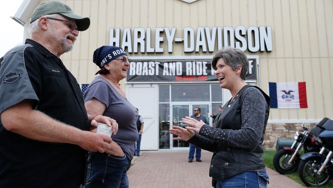 Sen. Joni Ernst (right) talks with Herb and Maria Damstrom of Bondurant Saturday, Aug. 27, 2016, as they get ready to head out from the Big Barn Harley Davidson dealership to the Iowa State Fairgrounds for the second annual Roast and Ride in Des Moines.