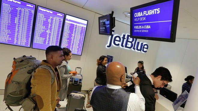 Passengers check in for JetBlue's inaugural flight from New York to Havana at JFK Airport on Nov. 28, 2016.