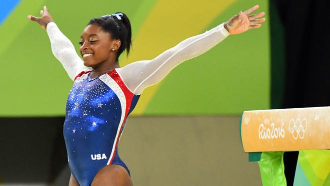Simone Biles (USA) competes on the balance beam during the women's individual all-around final in the Rio 2016 Summer Olympic Games at Rio Olympic Arena.