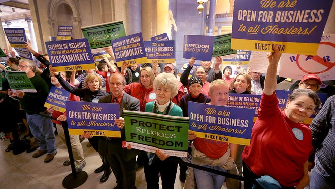 Supporters and opponents of Senate Bill 101, the “religious freedom” bill, are shown standing outside the House chambers on March 19, 2015, at the Indiana Statehouse.