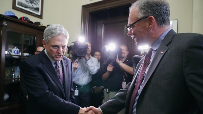 Supreme Court nominee Merrick Garland is greeted by Kaine before they sit down for a meeting in the Russell Senate Office Building on Capitol Hill on April 21, 2016.