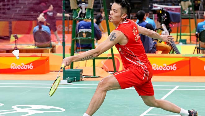Dan Lin of China strteches for a shot during badminton preliminaries in the Rio 2016 Summer Olympic Games at Riocentro - Pavilion 4.