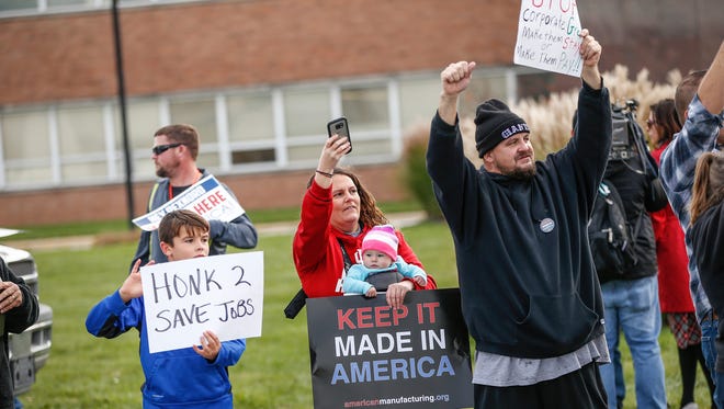 Employees of Rexnord Bearings in Indianapolis, local union reps and family members of the employees protest Nov. 11, 2016, Rexnord's decision to move 300 jobs to Mexico.
