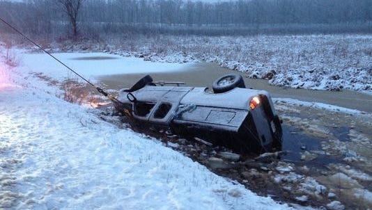 Three people were rescued after a pickup truck plunged into the icy Apple River.
