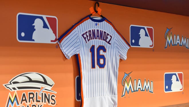 A New York Mets jersey hangs in the dugout honoring Jose Fernandez.