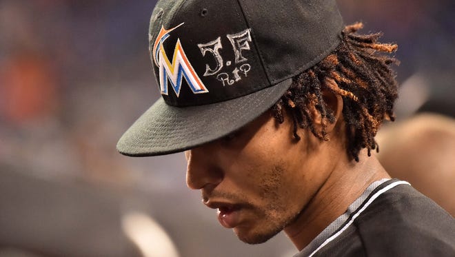 Marlins relief pitcher Jose Urena wears a hat with a memorial for Jose Fernandez.