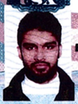 This undated passport photo provided by the U.S. Attorney's Office in Chicago shows Mohammed Hamzah Khan.