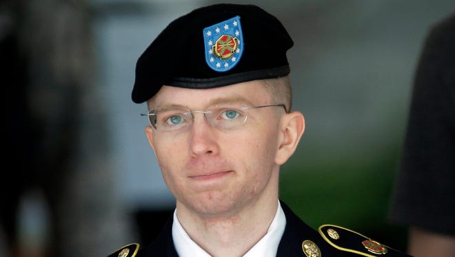 In this June 5, 2013, file photo Army Pvt. Chelsea Manning, then-Army Pfc. Bradley Manning, is escorted out of a courthouse in Fort Meade, Md., during court martial proceedings. Manning is serving a 35-year sentence for leaking documents.