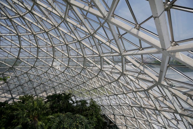 Masonry Restoration uses a specialized spider lift as repair work begins on the Tropical Dome at the Mitchell Park Domes Horticulture Conservatory in July, 2016.