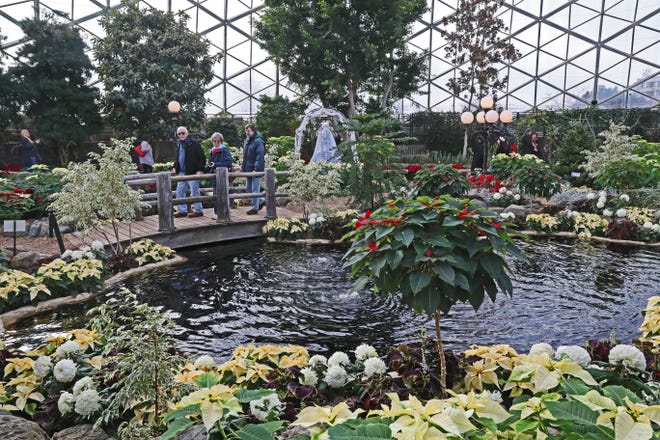 People tour the Mitchell Park Horticultural Conservatory “Scrooooge!” Holiday floral Show in December, 2018.