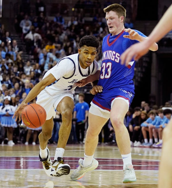 Nicolet's Davion Hannah (25) attempts to get pass Wisconsin Lutheran's Kon Knueppel (33) during the first half of the WIAA Division 2 boys basketball state semifinal game on Friday March 15, 2024 at the Kohl Center in Madison, Wis.