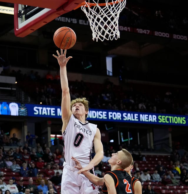 Pewaukee's Dawson Farra (0) scores over West Salem's Joe Sullivan (2) during the second half of the WIAA Division 2 boys basketball state semifinal game on Friday March 15, 2024 at the Kohl Center in Madison, Wis.