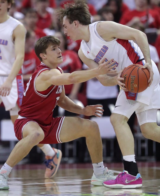 Neenah High School's Grant Dean (13) against Arrowhead High School's Bennett Basich (14) in a Division 1 semifinal game during the WIAA state boys basketball tournament on Friday, March 15, 2024 at the Kohl Center in Madison, Wis. Arrowhead defeated Neenah for 99-95 in four overtimes.
Wm. Glasheen USA TODAY NETWORK-Wisconsin