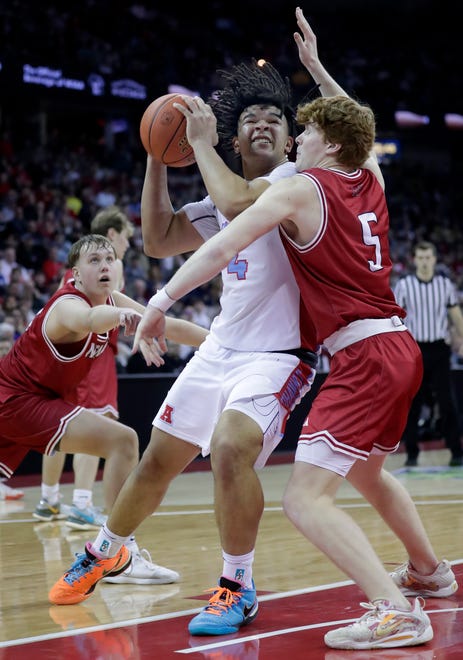 Arrowhead High School's Jace Gilbert (4) against Neenah High School's Luke Jung (5) in a Division 1 semifinal game during the WIAA state boys basketball tournament on Friday, March 15, 2024 at the Kohl Center in Madison, Wis. Arrowhead defeated Neenah for 99-95 in four overtimes.
Wm. Glasheen USA TODAY NETWORK-Wisconsin