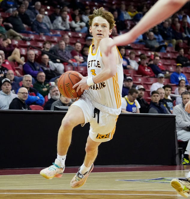 Kettle Moraine's Will Stuckey (3) drives up the court during the second half of the WIAA Division 1 boys basketball state semifinal game against Marquette on Friday March 15, 2024 at the Kohl Center in Madison, Wis.