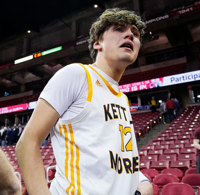 Kettle Moraine's Ben Bestor (12) reacts to the loss against Marquette in the WIAA Division 1 boys basketball state semifinal game on Friday March 15, 2024 at the Kohl Center in Madison, Wis.