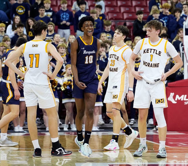 Marquette's Jeremiah Johnson (10), Kettle Moraine's Nathan Vuillaume (11), Roman Thompson (23), Jack McSorley (1) react to the final score as Marquette beats Kettle Moraine in the WIAA Division 1 boys basketball state semifinal game on Friday March 15, 2024 at the Kohl Center in Madison, Wis.