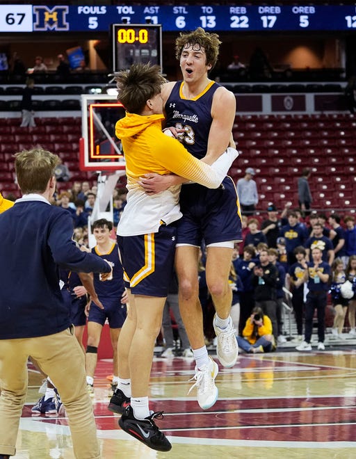Marquette's Nolan Minessale (23) celebrates the victory over Kettle Moraine in the WIAA Division 1 boys basketball state semifinal game on Friday March 15, 2024 at the Kohl Center in Madison, Wis.