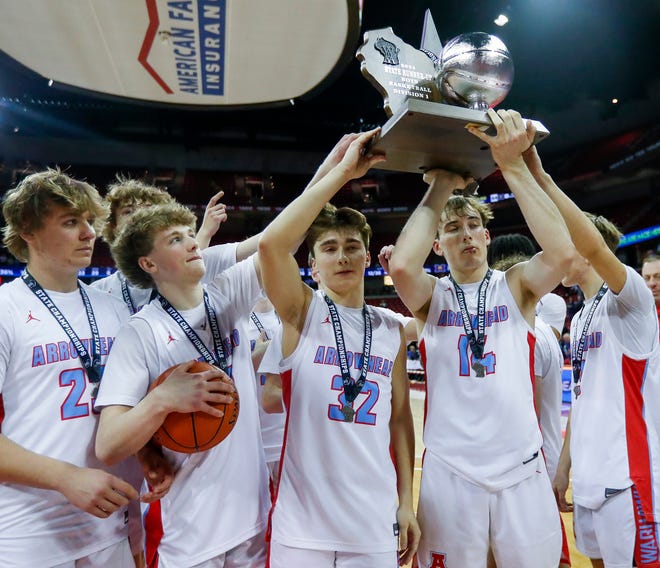 Arrowhead High School's Jay Haase (32) and Bennett Basich (14) hold up the trophy as they and their teammates thank their fans after losing to Marquette University High School in the Division 1 state championship game during the WIAA state boys basketball tournament on Saturday, March 16, 2024 at the Kohl Center in Madison, Wis. Marquette won the game, 84-62.