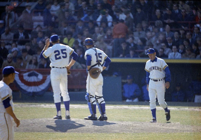 Brewers manager Dave Bristol visits pitcher John Gelnar and catcher Jerry McNertney during the Brewers' first opening day on April 7, 1970. The game was also the season opener for the Brewers. A crowd of 37,237 saw the Brewers fall to the California Angels 12-0.