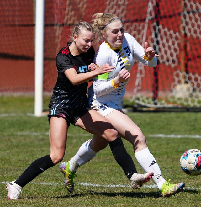Arrowhead's Avery Fitzgerald, left, battles with Whitnall's Ella Koch (31) during the match at Arrowhead on Saturday, April 6, 2024.