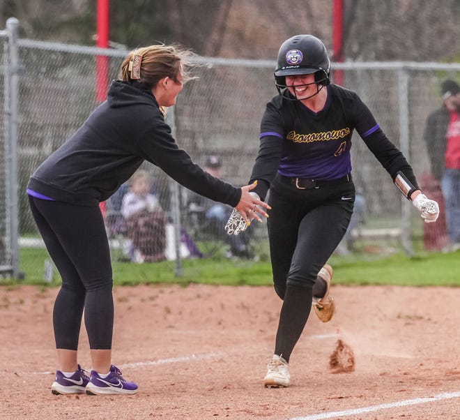 Oconomowoc's Kelsey Yambor (4) gets a high five from Oconomowoc co-head coach Chloe Auxier after hitting a home run in the game at Arrowhead, Tuesday, April 16, 2024.