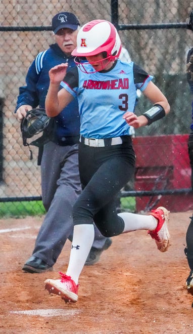 Arrowhead's Molly Boerst (3) scores from first after series of errors by Oconomowoc in Hartland, Tuesday, April 16, 2024.