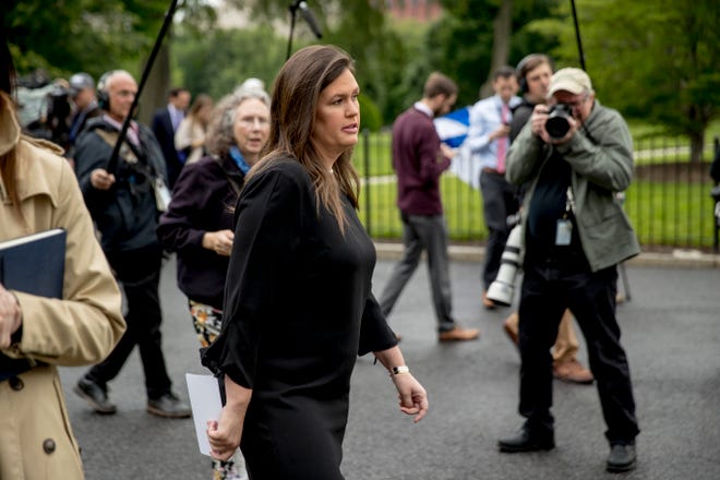 White House press secretary Sarah Huckabee Sanders walks into the West Wing of the White House after speaking members of the media, May 16, 2019, in Washington.